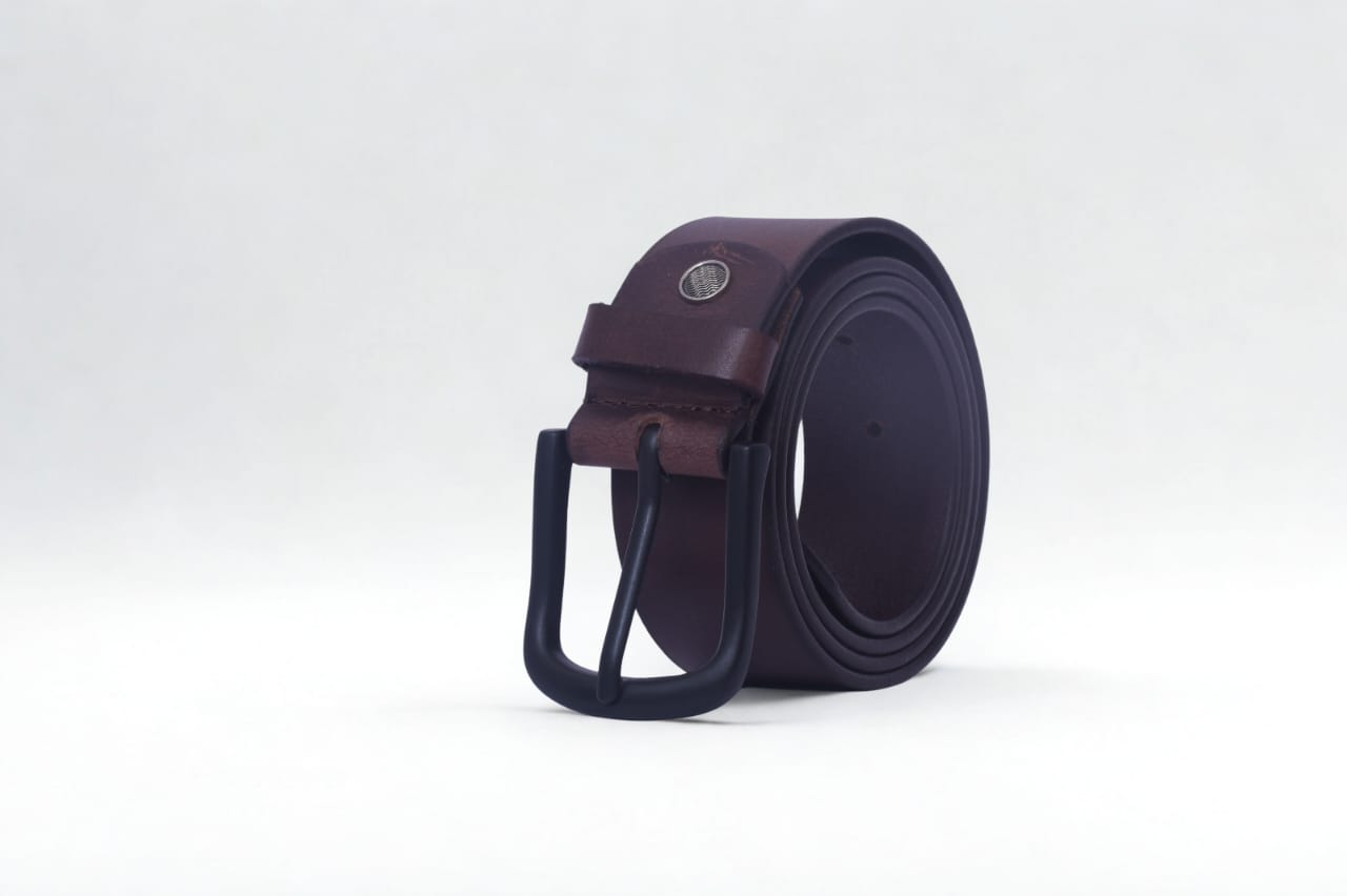 Skilled artisan working on leather bag in well-lit workshop